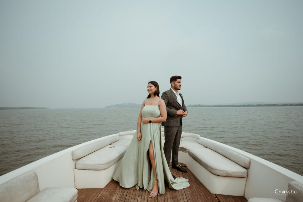 A cute couple standing in a ship with a cute style captured by wedding photographer in Delhi/NCR.