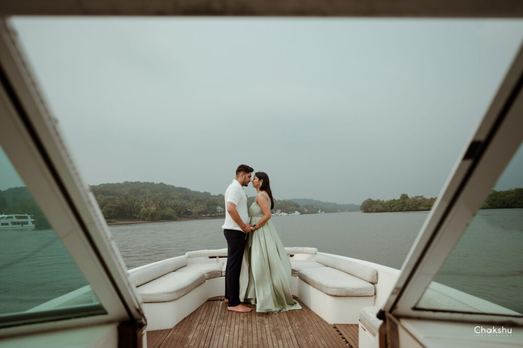 Pre wedding image of a couple standing on a ship image captured by best pre-wedding photographer in delhi.