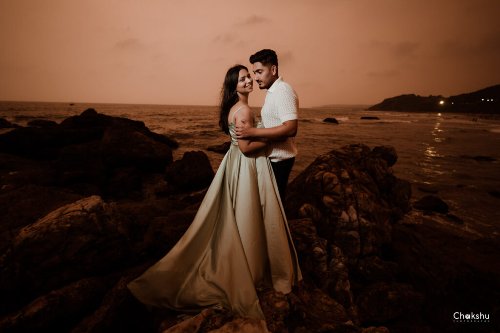 Pre wedding image of a couple standing on a beach image captured by best pre-wedding photographer in delhi.