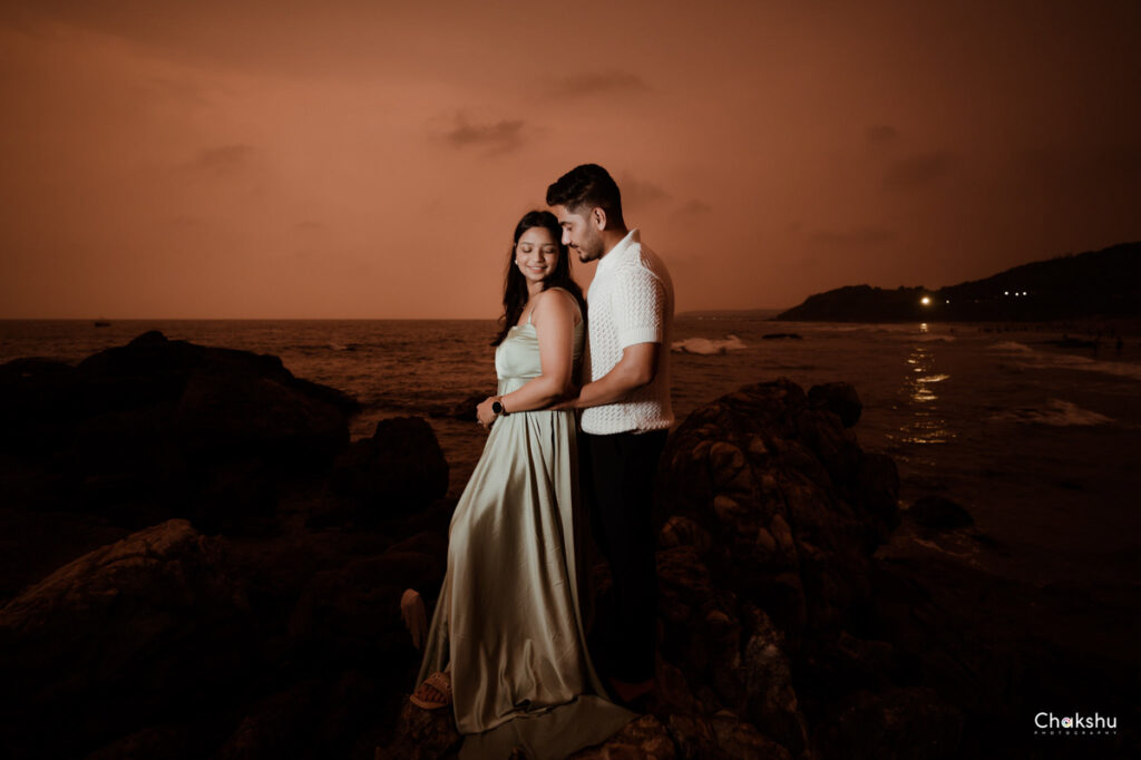 Pre wedding image of a couple standing on a beach image captured by best pre-wedding photographer in delhi.