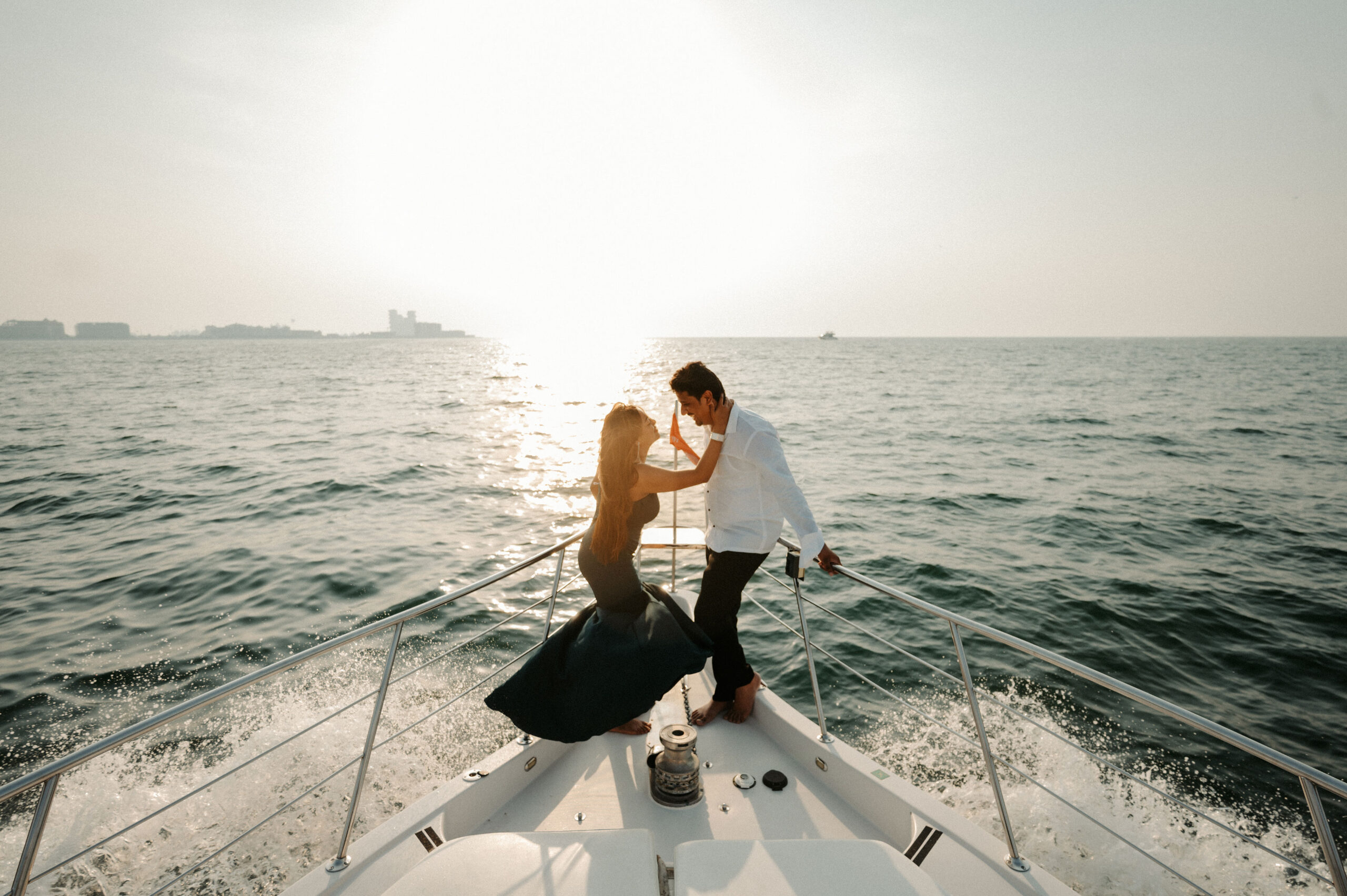 Image of a couple on a ship capture by best pre-wedding photographer in delhi